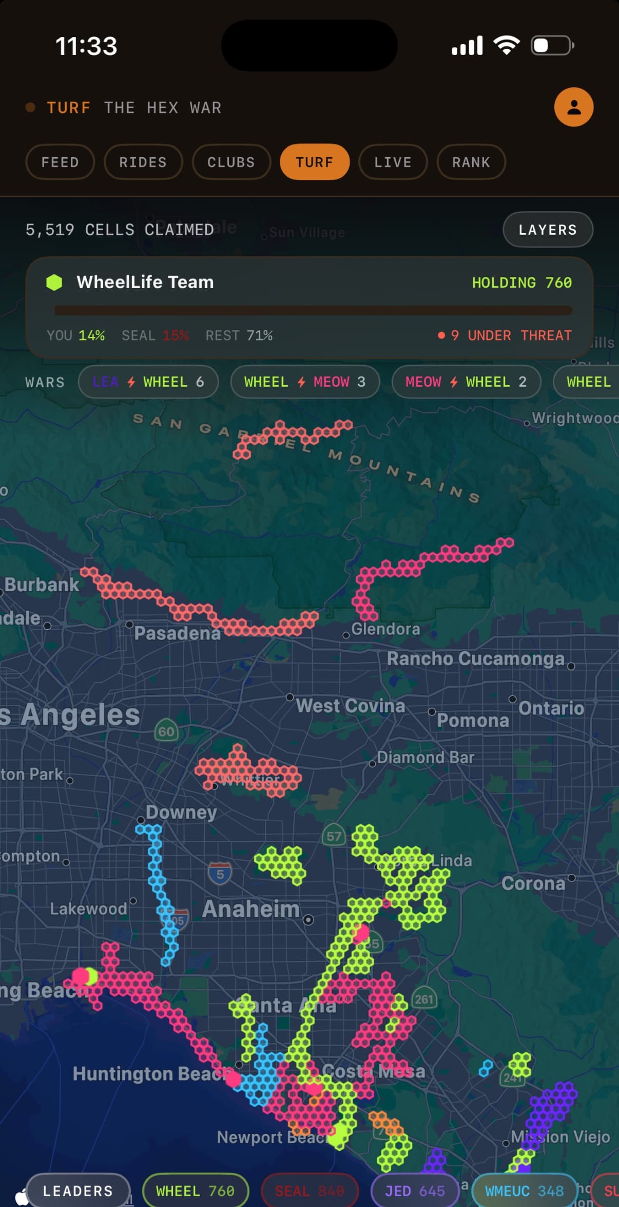 The Wheel Life turf map over Los Angeles and Orange County: thousands of hex cells coloured by the club that holds them, above the club standings and the running wars.